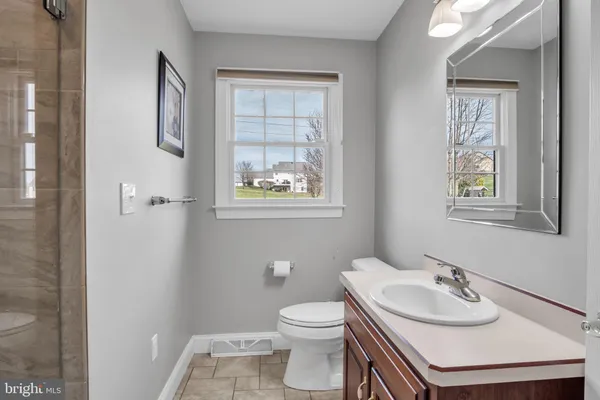 a bathroom with a sink and a window