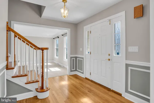 a view of an entryway with wooden floor