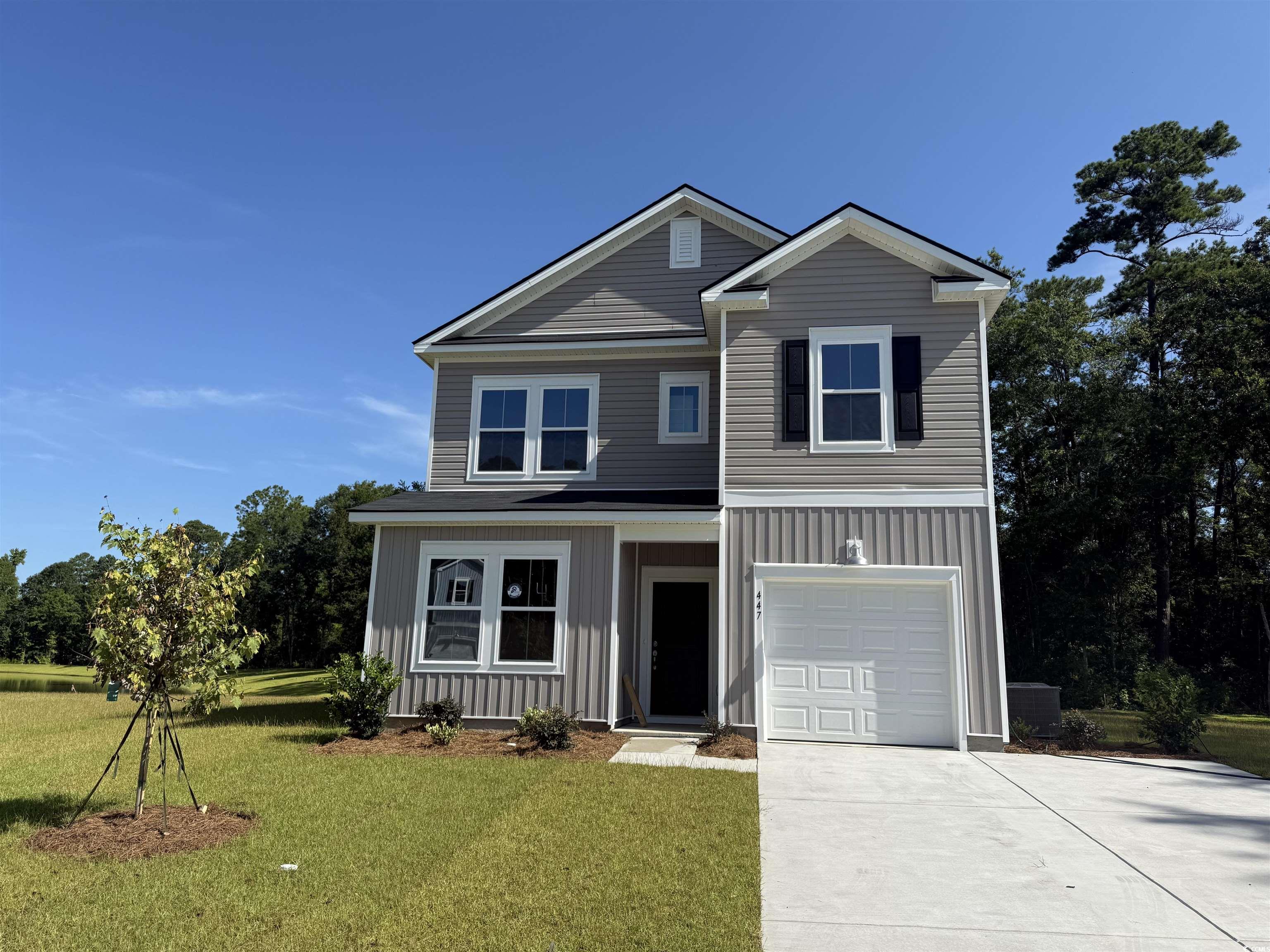 447 Falling Leaf Loop Myrtle Beach, SC 29588 - Photo 1 of 1 View of front of house with a front yard, concrete