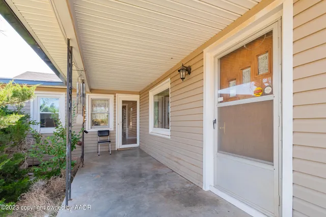 a view of a porch with wooden floor