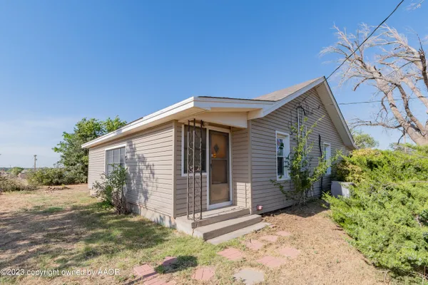 a house with a tree in front of it