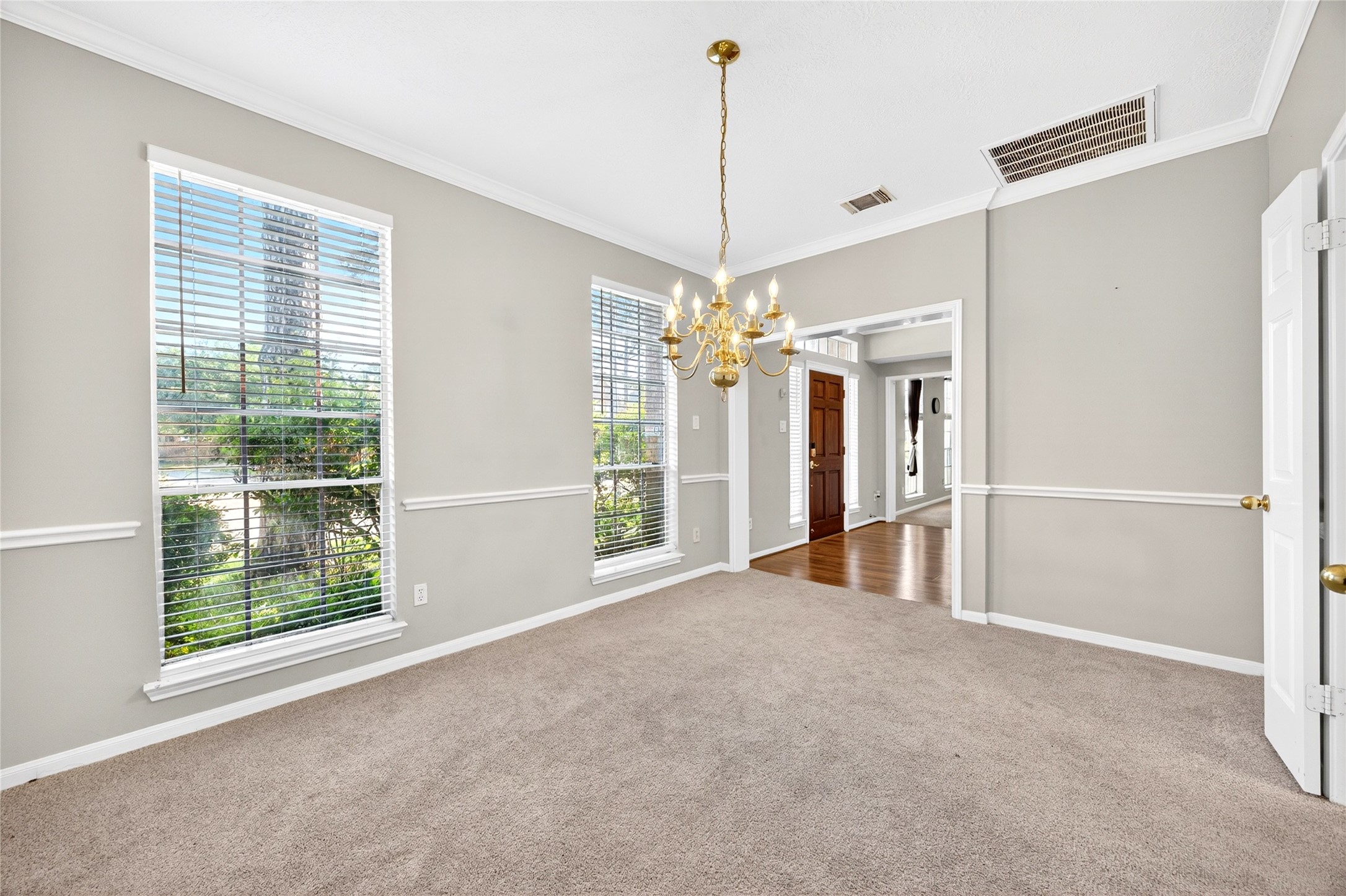 10615 Vandercroft Court Houston, TX 77070 - Photo 12 of 47 a view of a room with a windows and ceiling fan