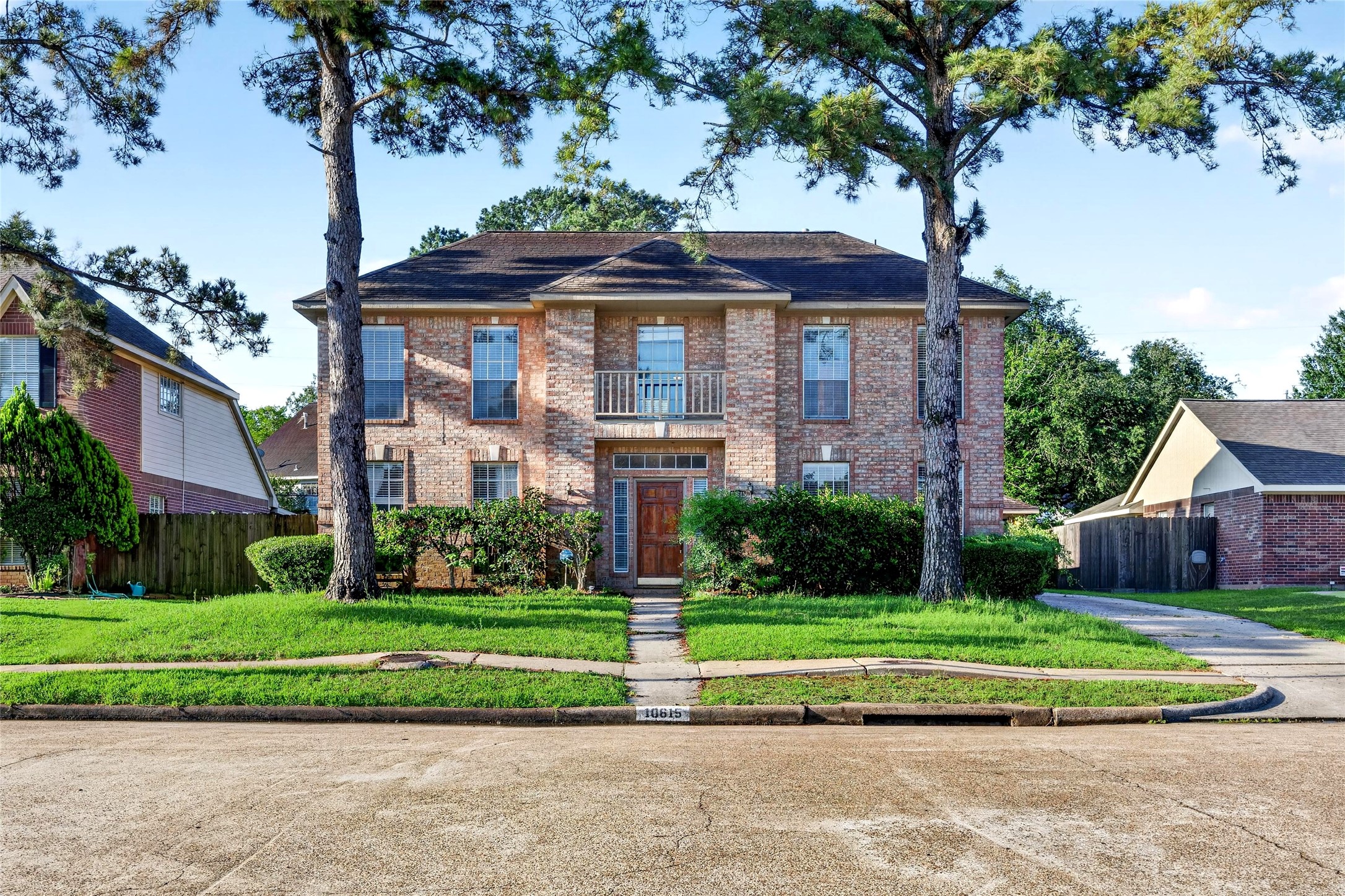 10615 Vandercroft Court Houston, TX 77070 - Photo 2 of 47 a front view of a house with a yard
