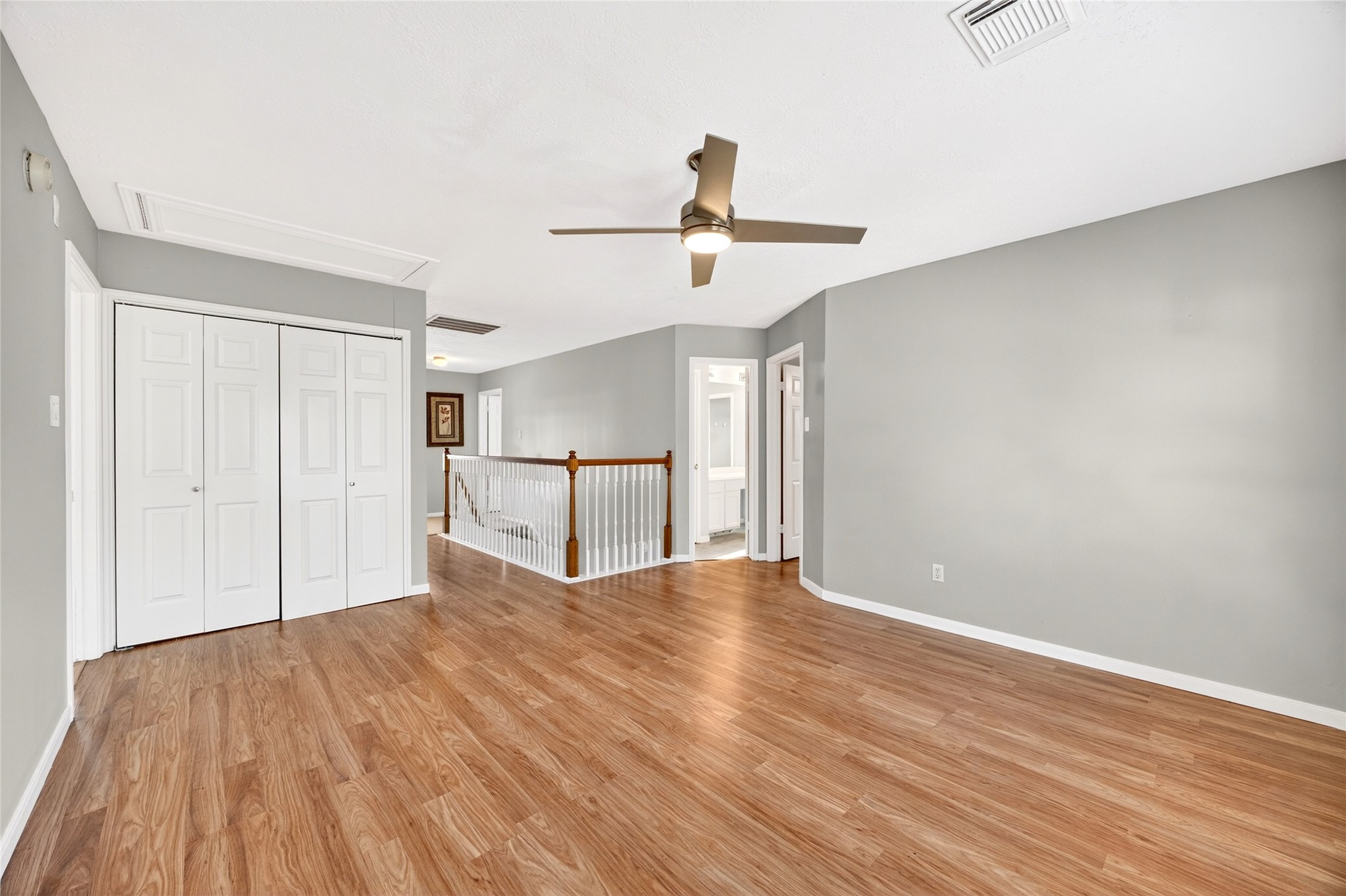 10615 Vandercroft Court Houston, TX 77070 - Photo 25 of 47 a view of empty room with wooden floor and ceiling fan
