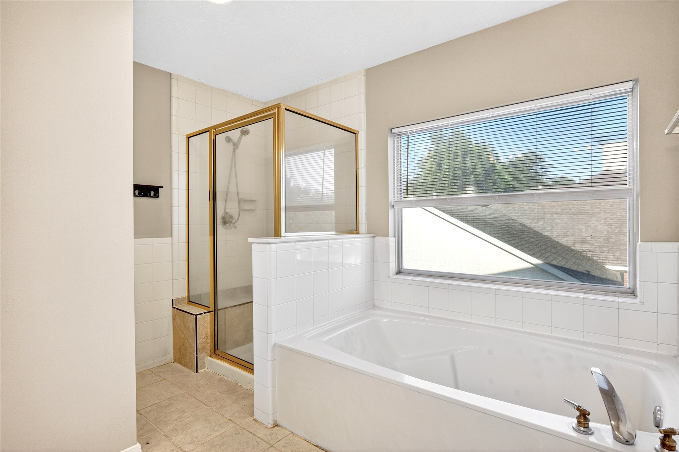 10615 Vandercroft Court Houston, TX 77070 - Photo 31 of 47 a bathroom with a bathtub and a shower