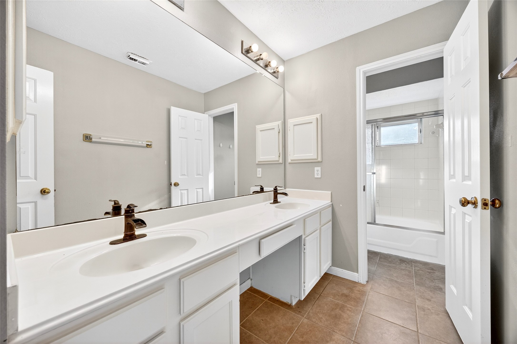 10615 Vandercroft Court Houston, TX 77070 - Photo 35 of 47 a bathroom with a sink and a mirror