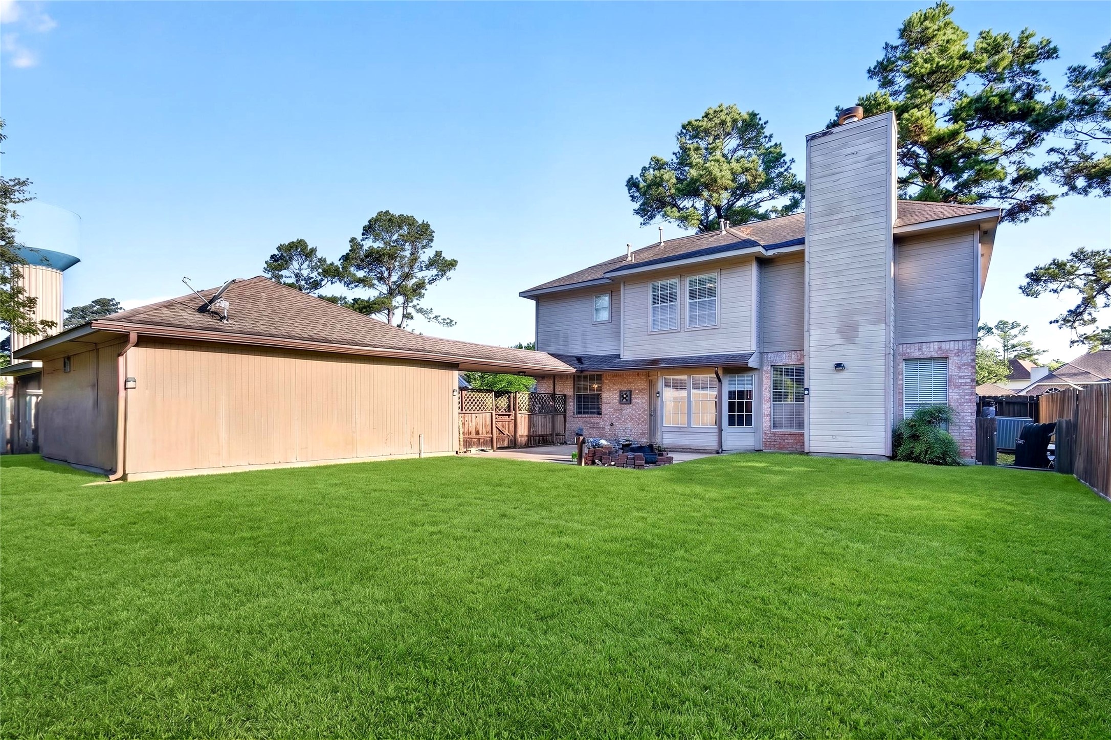 10615 Vandercroft Court Houston, TX 77070 - Photo 40 of 47 a view of a house with a yard plants and large tree