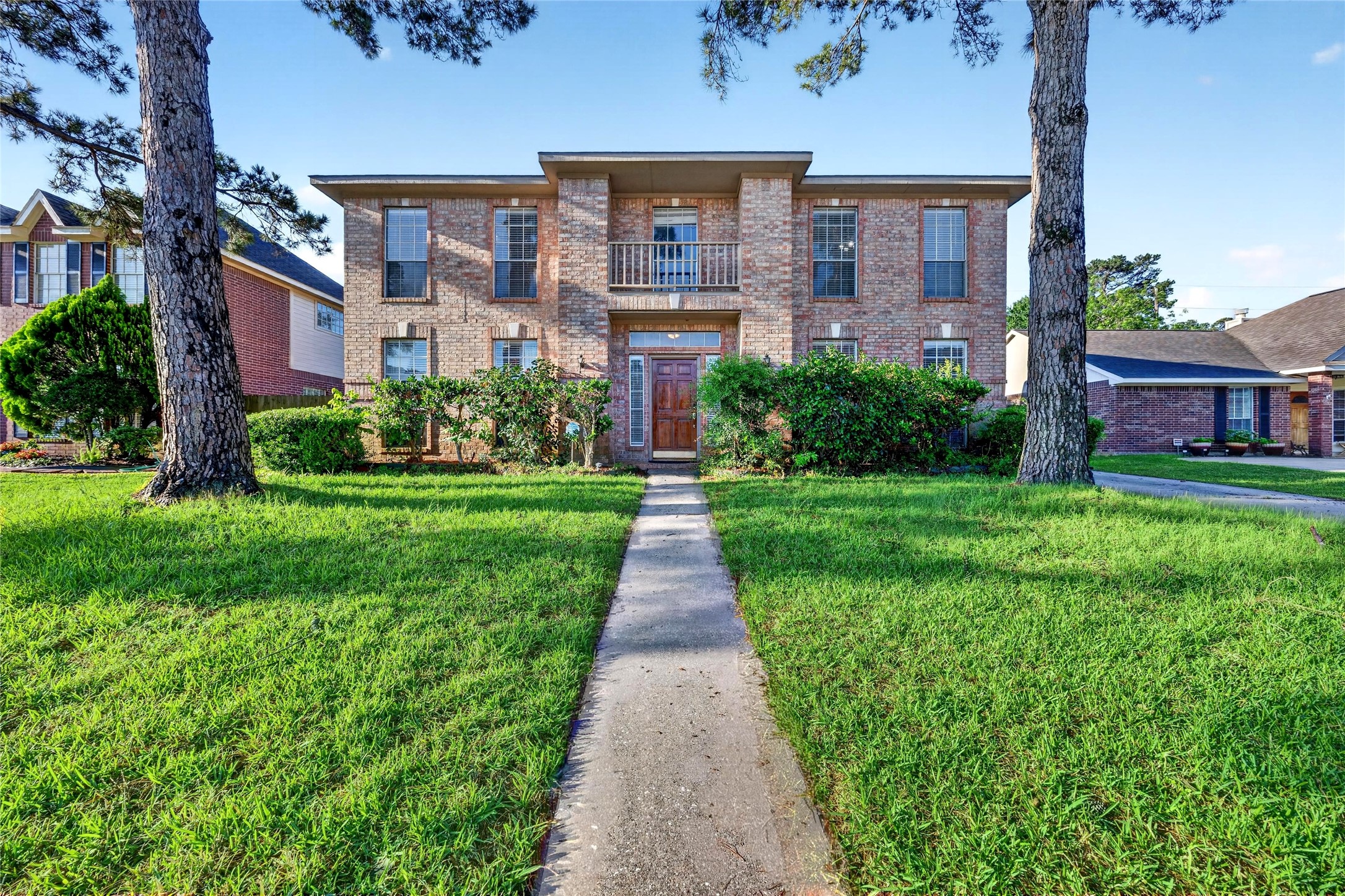 10615 Vandercroft Court Houston, TX 77070 - Photo 6 of 47 front view of a brick house with a yard