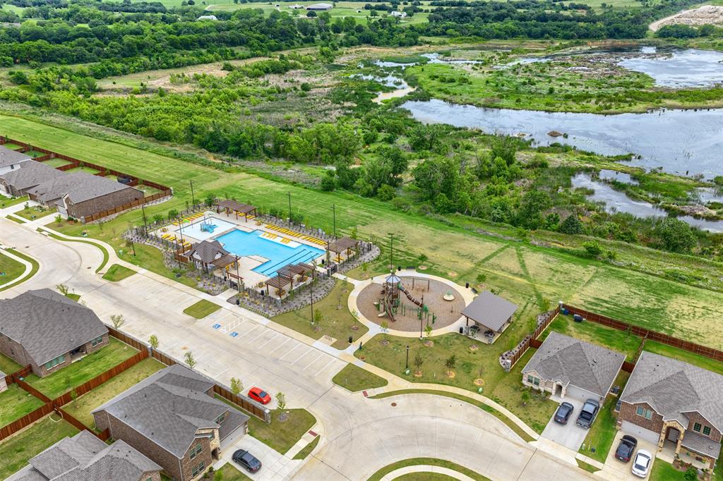 3808 High Country Road Aubrey, TX 76227 - Photo 34 of 36 Community amenities featuring a swimming pool, lounge areas with pergolas, and a dedicated play area
