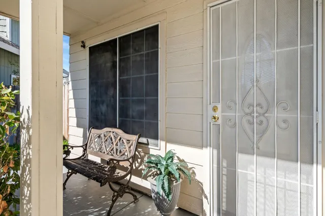 a view of a balcony with chair and table