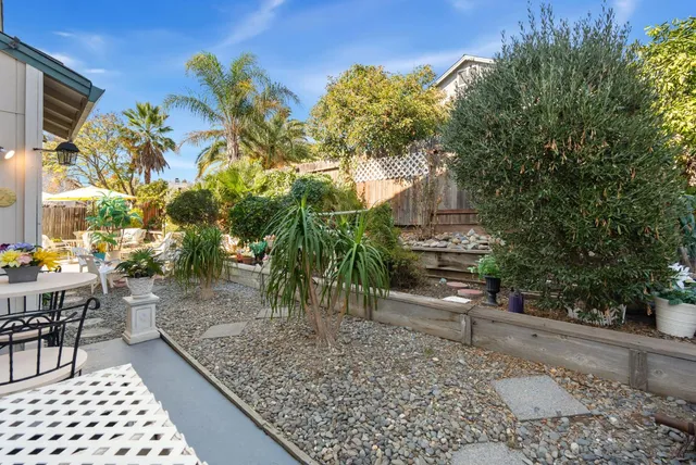 a view of a chairs and table in patio