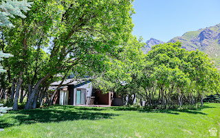 578 High Bench Road Alpine, UT 84004 - Photo 6 of 39 Expansive grassy area featuring mature trees and a mountain backdrop