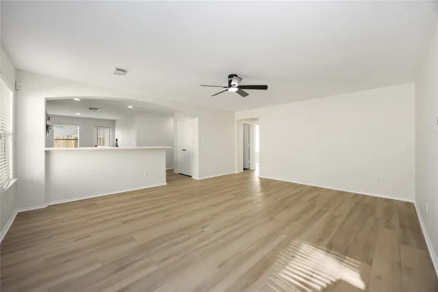 a view of a kitchen with a sink and cabinets