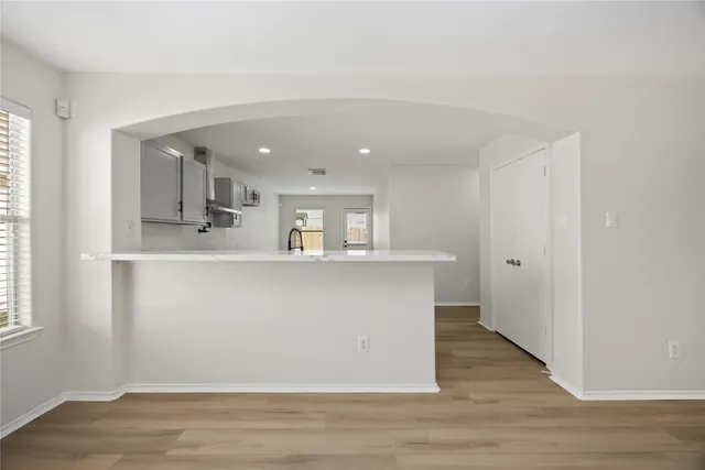 a view of living room with wooden floor and window