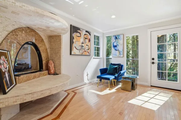a living room with furniture and large window