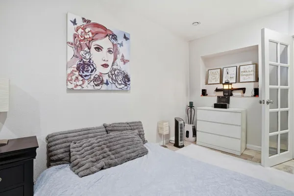 a bedroom with a bed and furniture