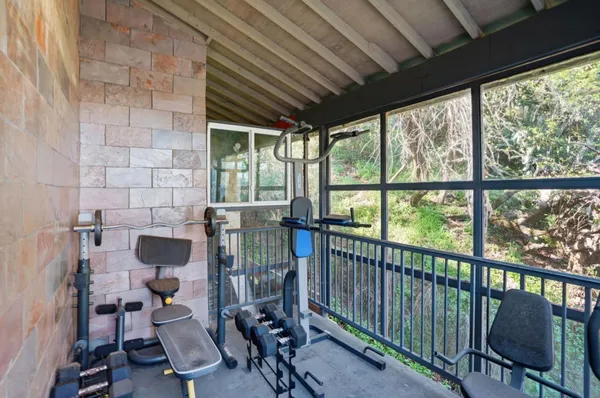 a view of a balcony with chairs