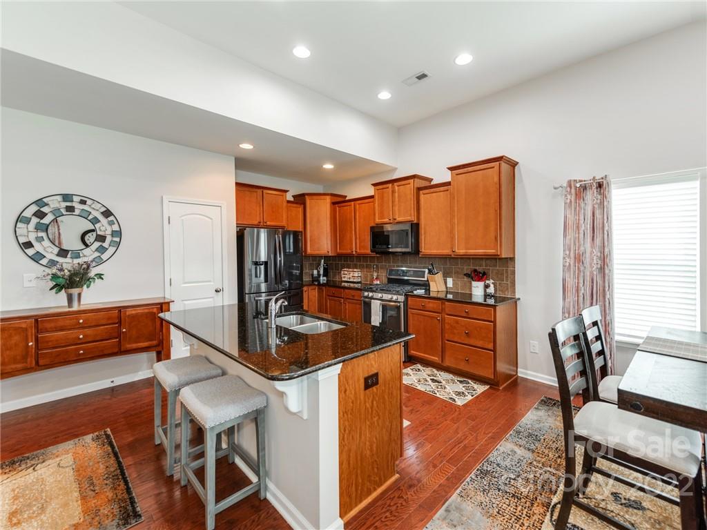 79378 Ridgehaven Road Lancaster, SC 29720 - Photo 10 of 36 a kitchen with stainless steel appliances granite countertop a sink and a refrigerator