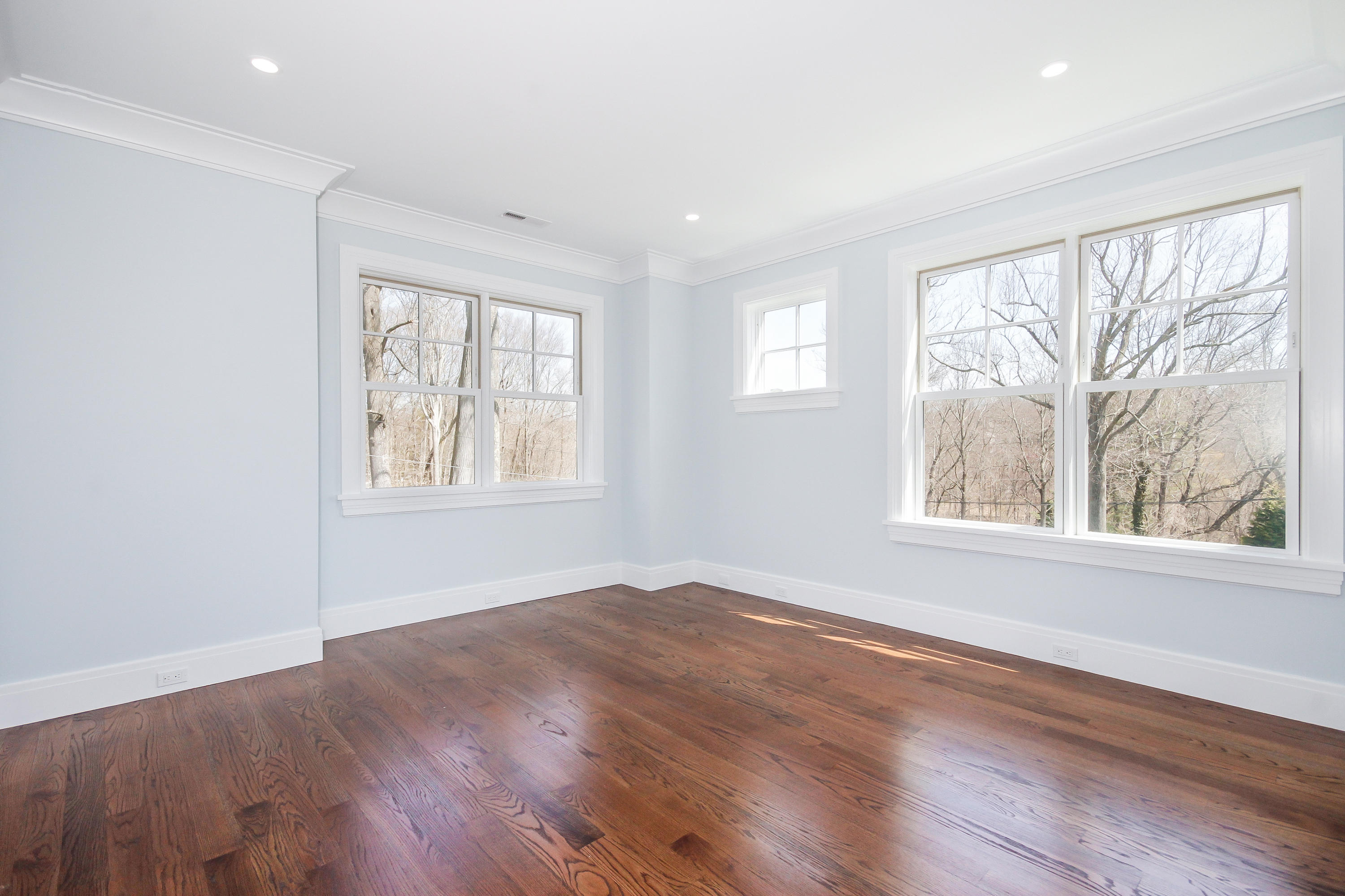 134 Lambert Road New Canaan, CT 06840 - Photo 32 of 50 a view of an empty room with wooden floor and a window