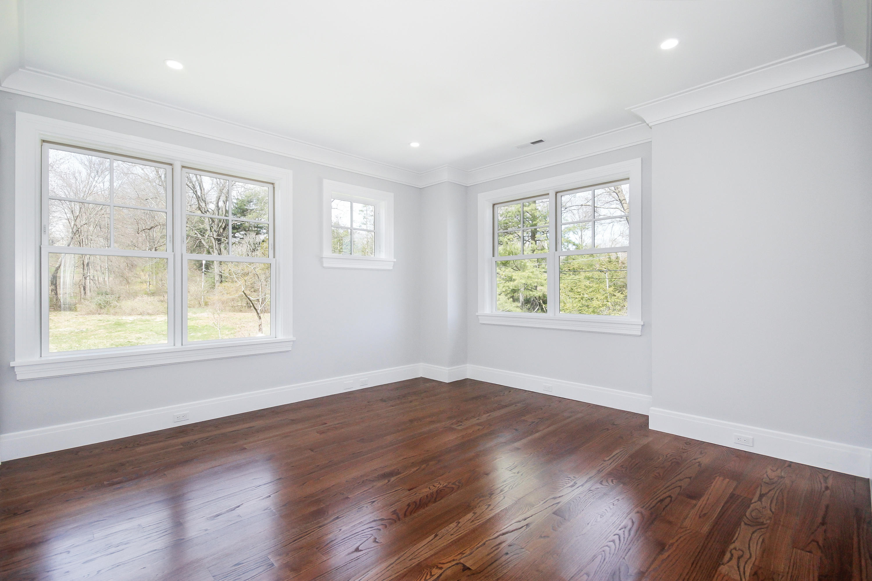 134 Lambert Road New Canaan, CT 06840 - Photo 35 of 50 an empty room with wooden floor and windows