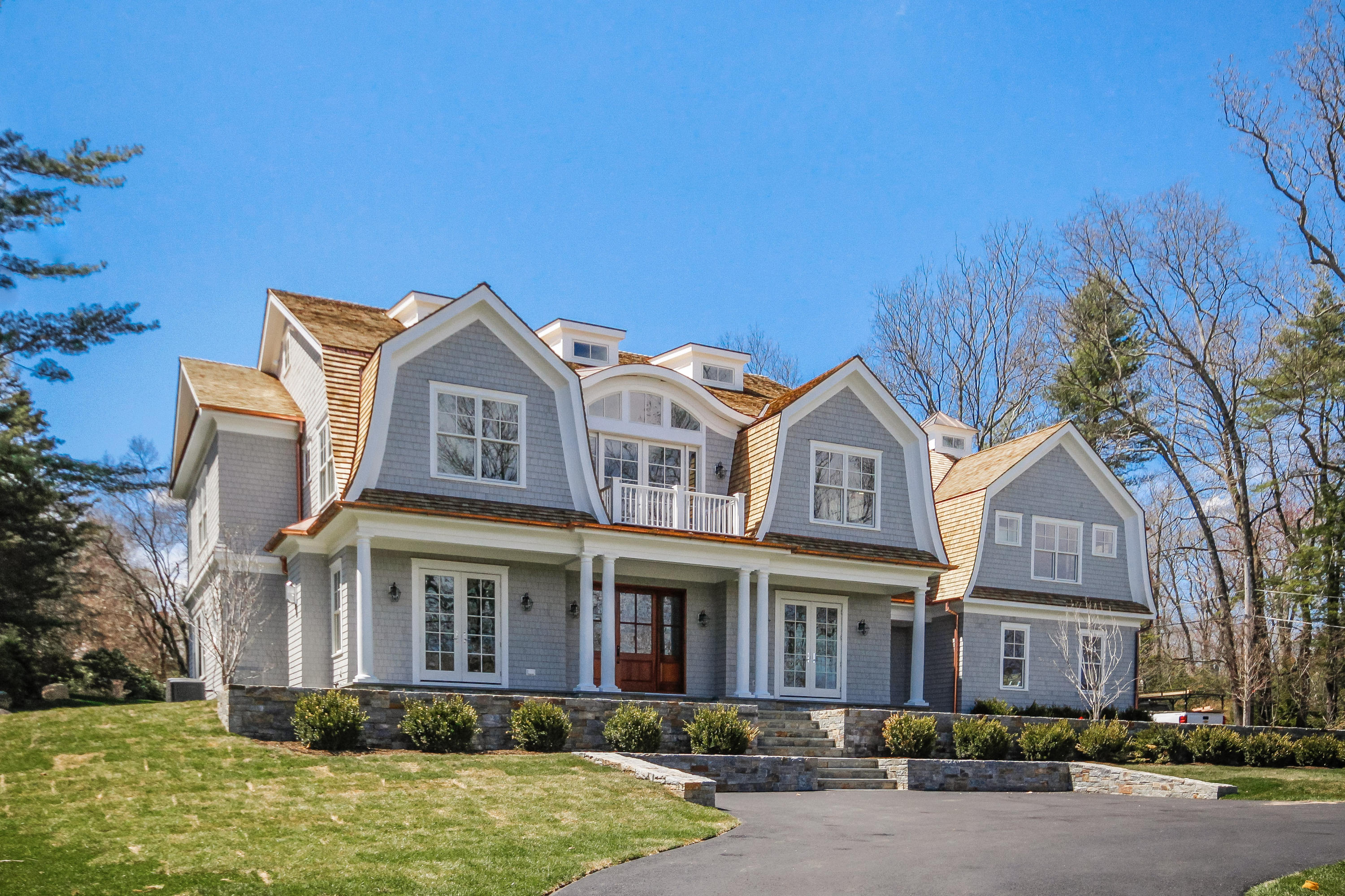 134 Lambert Road New Canaan, CT 06840 - Photo 41 of 50 a front view of a house with garden
