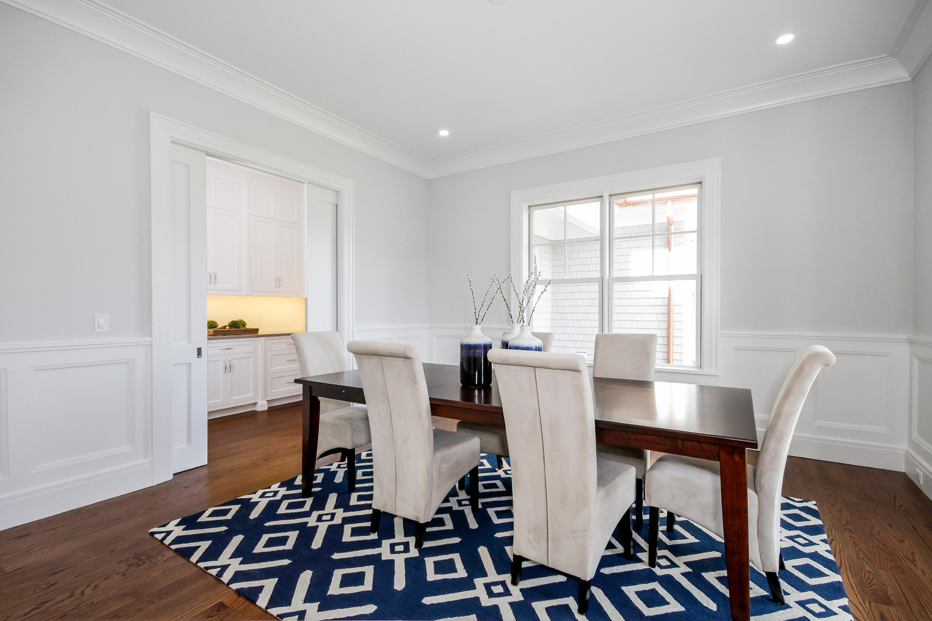 134 Lambert Road New Canaan, CT 06840 - Photo 6 of 50 a view of a dining room with furniture and wooden floor