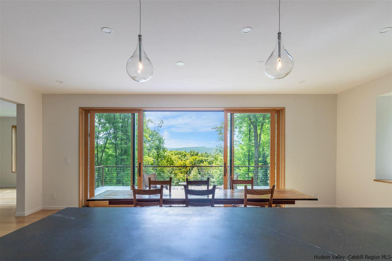 266 Kripplebush Road Stone Ridge, NY 12484 - Photo 9 of 34 a view of room with large windows and wooden floor
