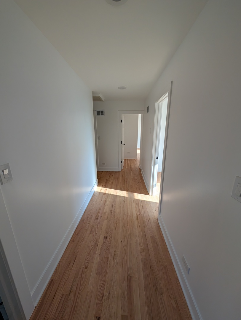 916 North Noble Street, Unit 2F Chicago, IL 60642 - Photo 13 of 22 a view of wooden floor in an empty room
