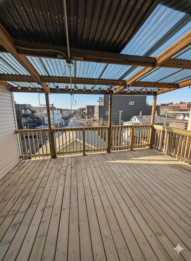 916 North Noble Street, Unit 2F Chicago, IL 60642 - Photo 21 of 22 a view of a balcony with wooden floor