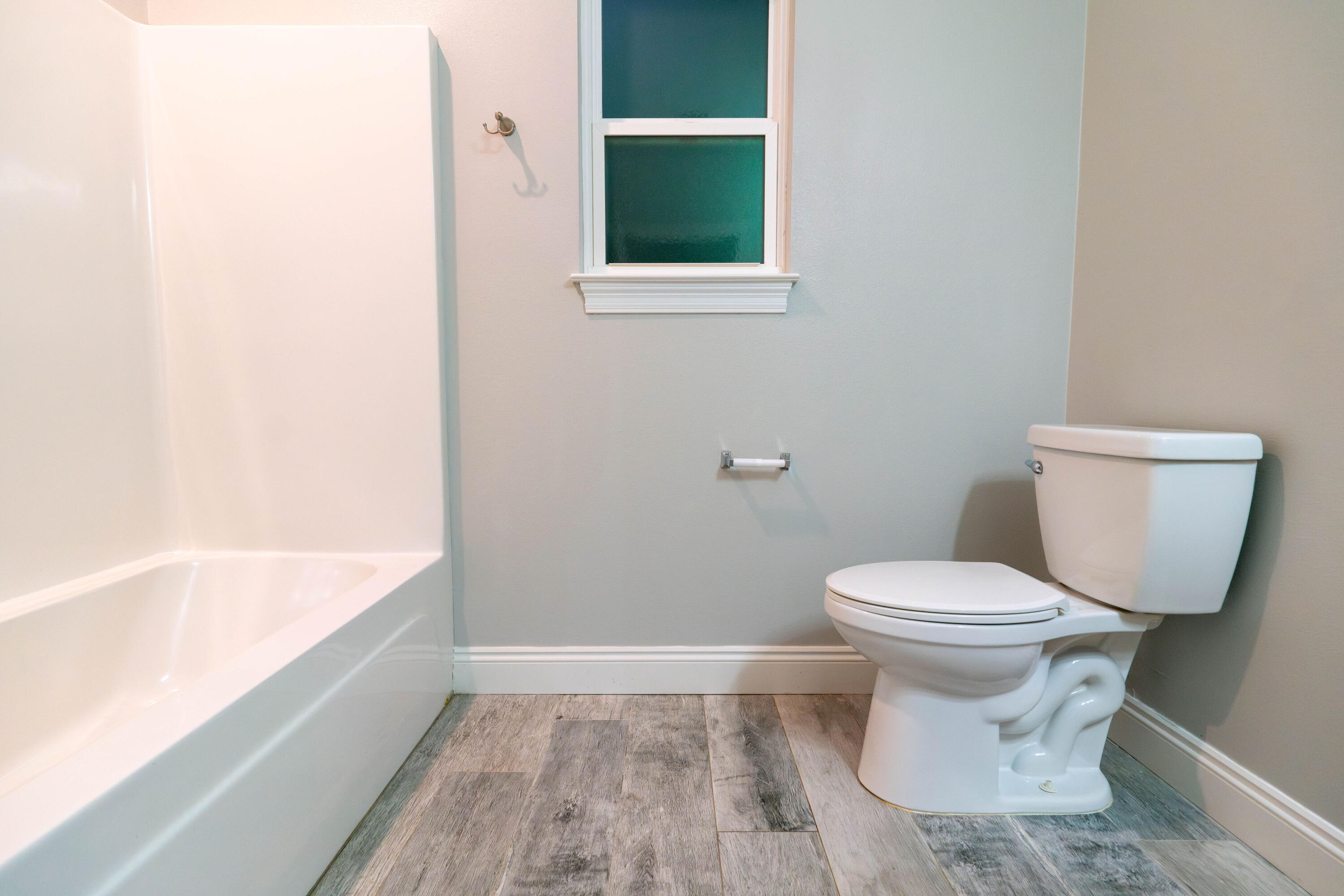 2243 Wind Trace Road North Navarre, FL 32566 - Photo 24 of 34 a bathroom with a toilet and a bathtub