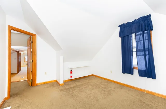 a view of a livingroom with workspace and a couch