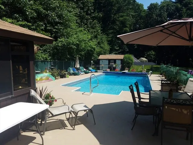 a wooden bench sitting in front of a building