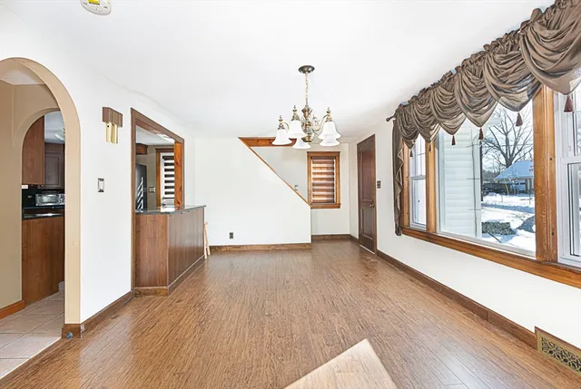 a view of an entryway with wooden floor