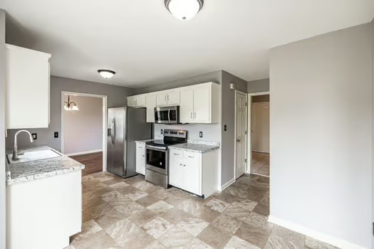2029 Copper Kettle Circle Pleasant View, TN 37146 - Photo 27 of 58 a kitchen with stainless steel appliances granite countertop a refrigerator sink and stove
