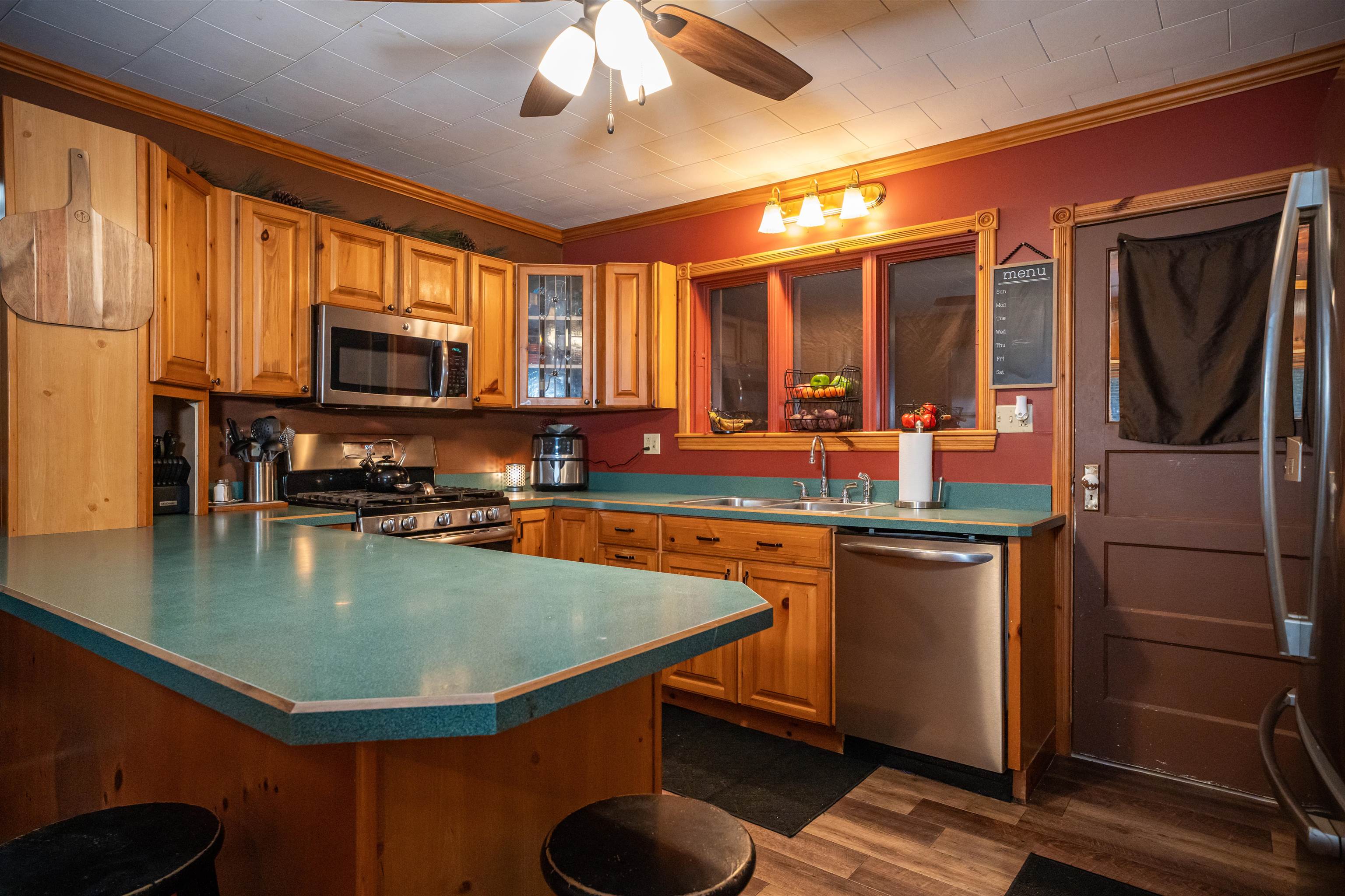 3605 Big Hill Road Chadwick, IL 61014 - Photo 28 of 99 a kitchen with stainless steel appliances granite countertop a sink refrigerator stove and microwave