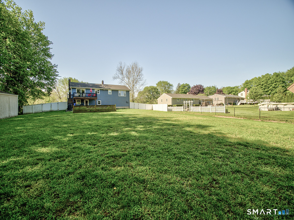82 Wilcox Road Middletown, CT 06457 - Photo 3 of 27 a view of a big yard with large trees and a big yard