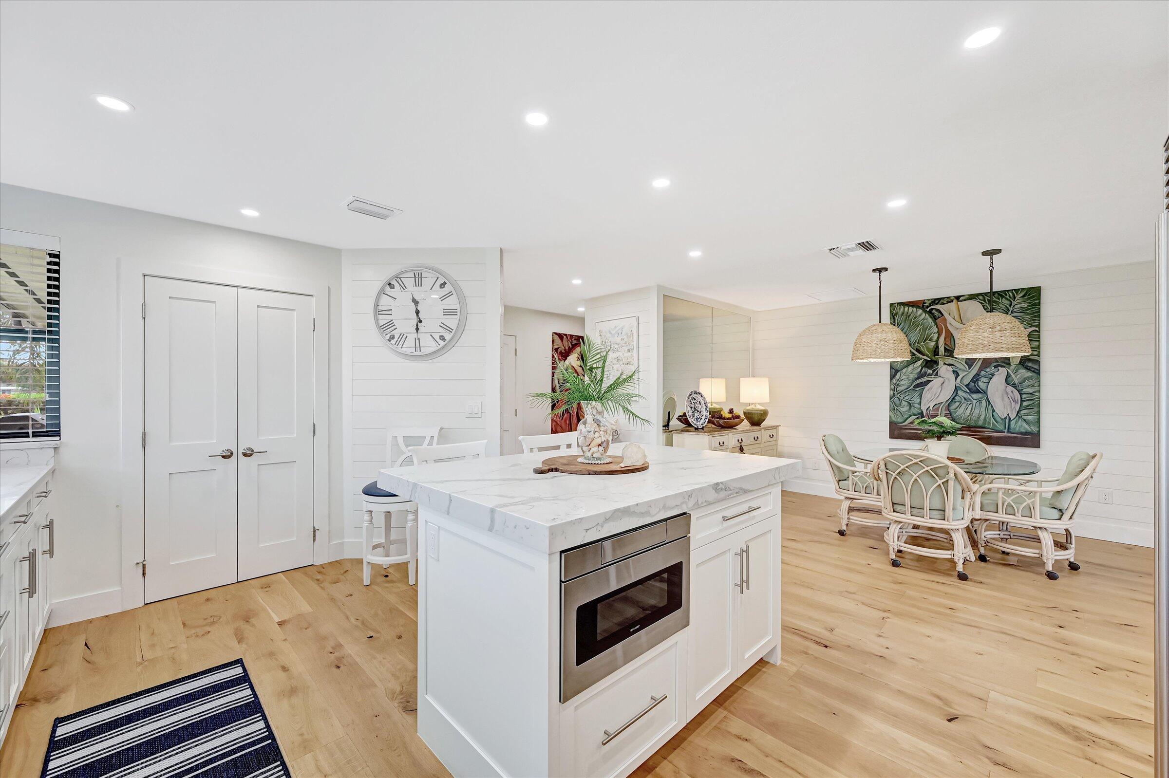 535 Augusta Boulevard, Unit 4 Naples, FL 34113 - Photo 25 of 44 a view of kitchen with sink microwave and stove
