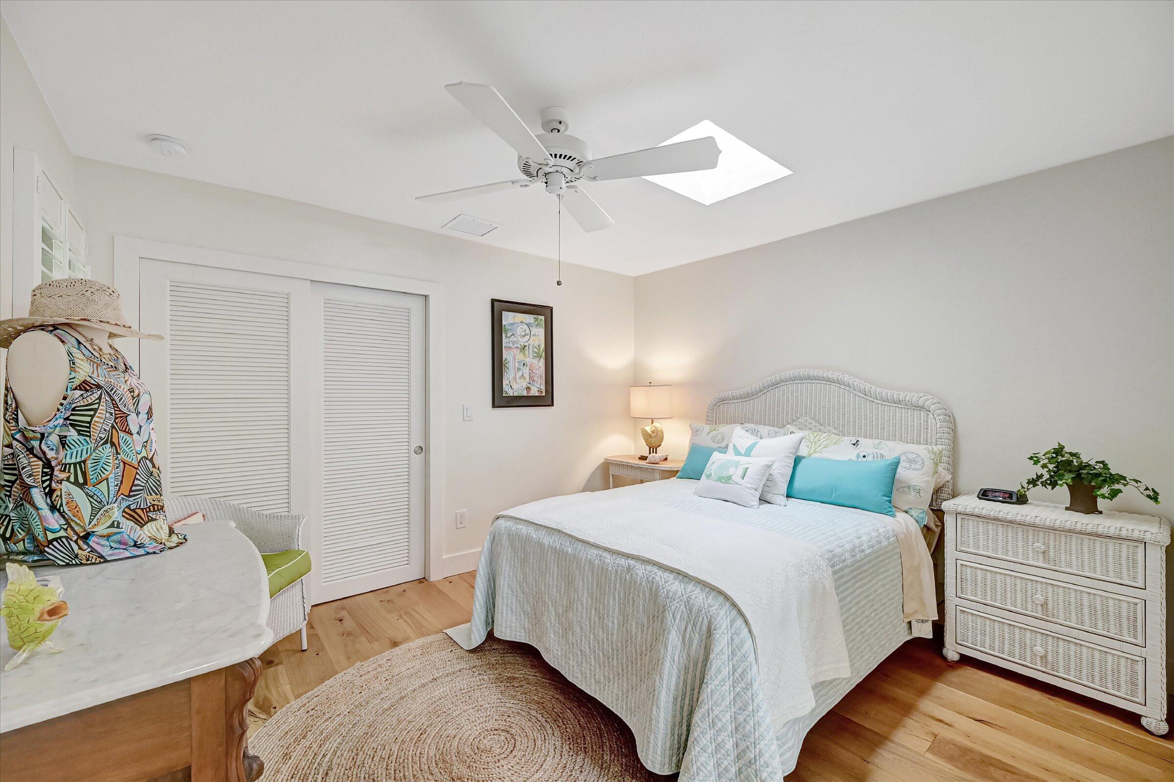 535 Augusta Boulevard, Unit 4 Naples, FL 34113 - Photo 36 of 44 a bedroom with a bed and a dresser