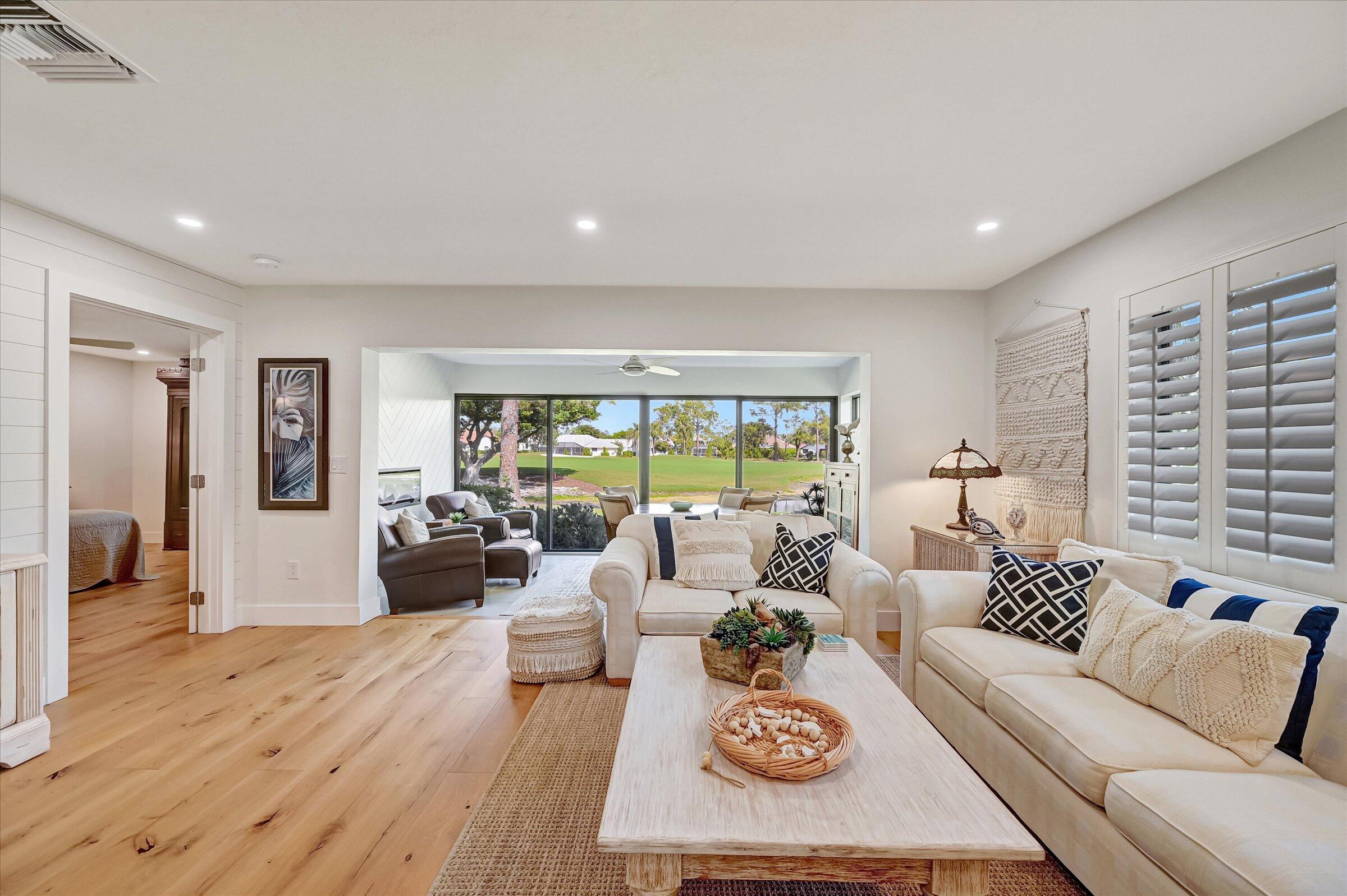 535 Augusta Boulevard, Unit 4 Naples, FL 34113 - Photo 10 of 44 a living room with furniture and a large window