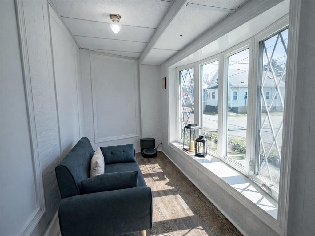 10 Guild Road Saugus, MA 01906 - Photo 5 of 32 a living room with furniture and a floor to ceiling window