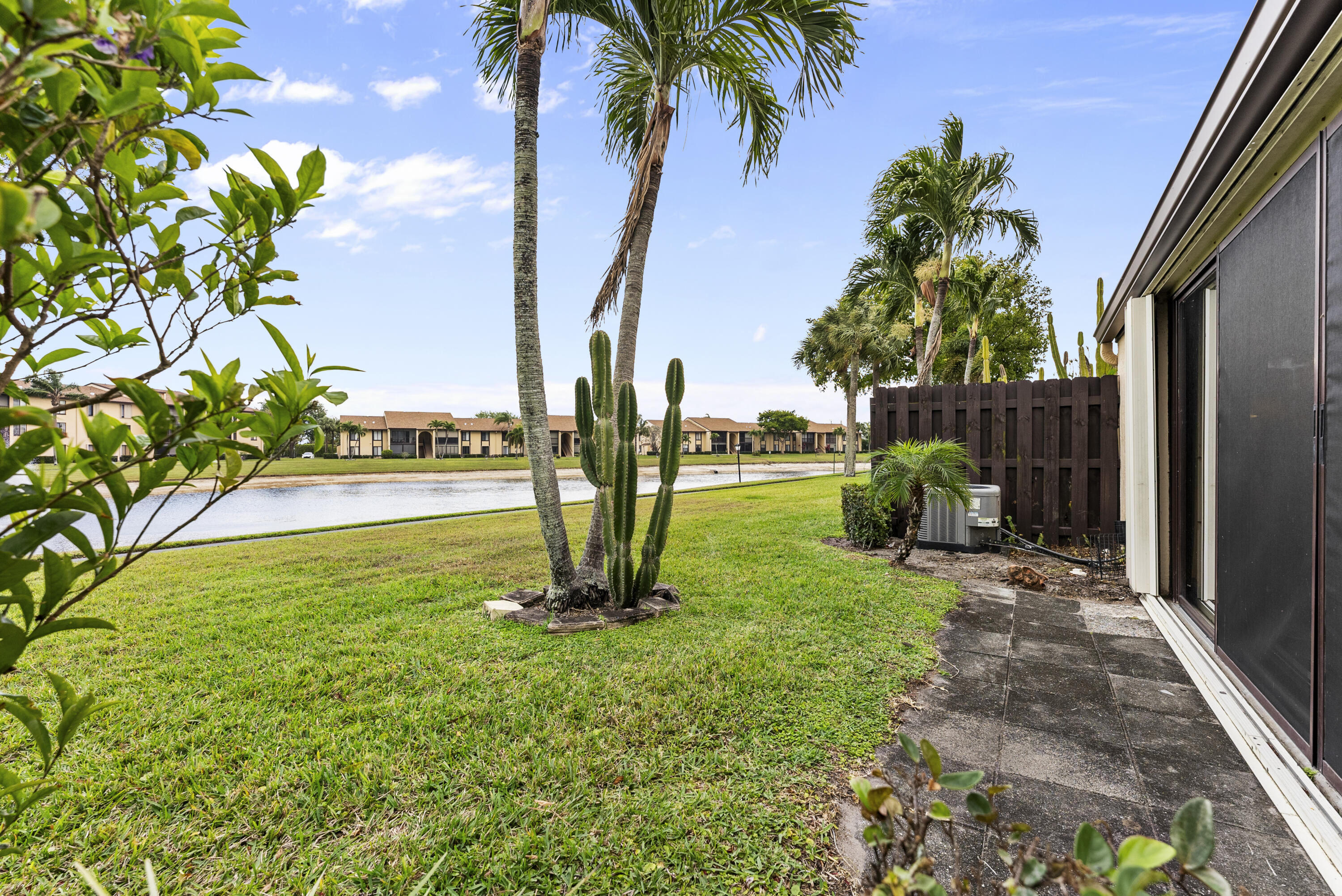 823 Sky Pine Way, Unit D Greenacres, FL 33415 - Photo 19 of 34 a view of a garden