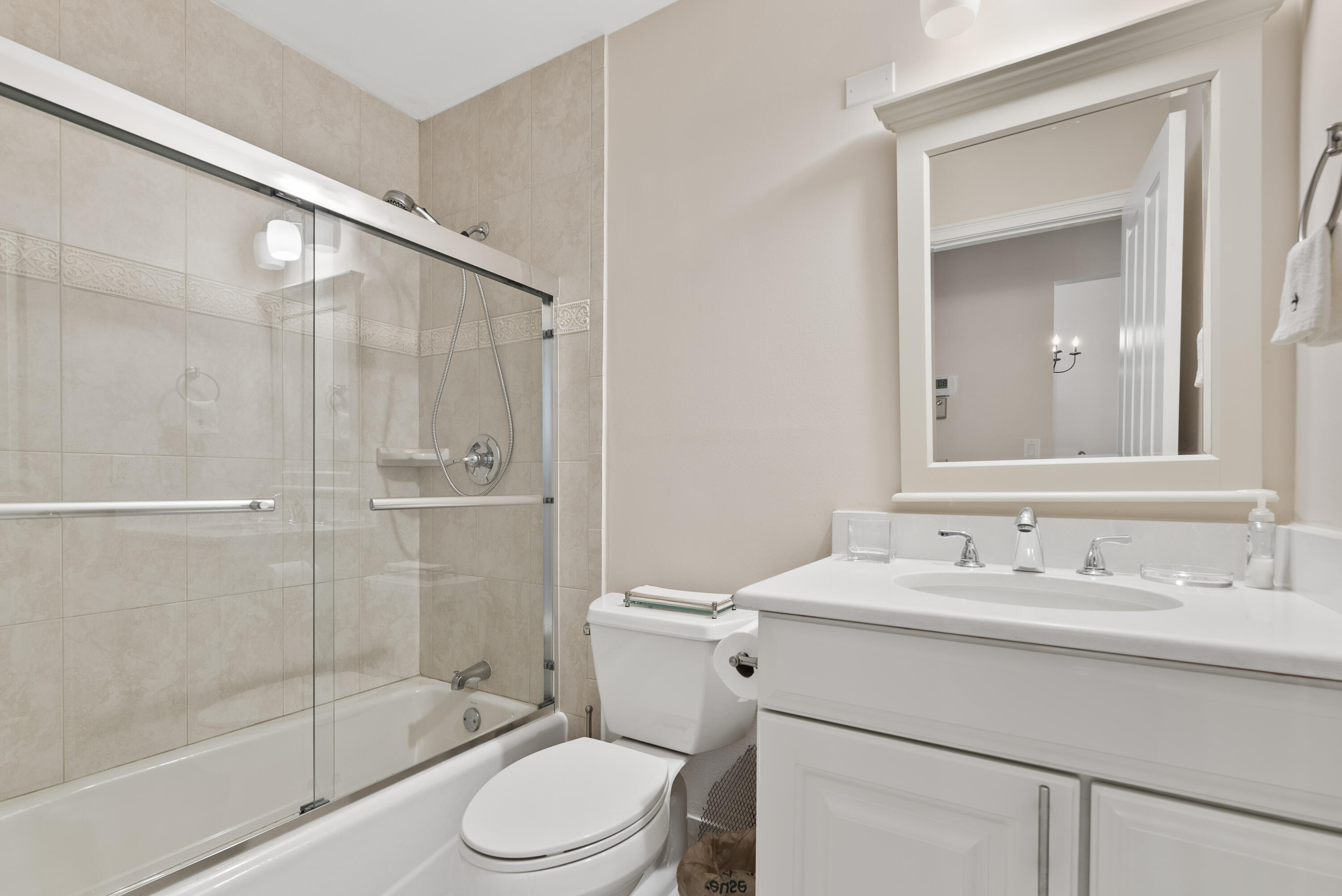 823 Sky Pine Way, Unit D Greenacres, FL 33415 - Photo 26 of 34 a bathroom with a sink toilet and shower