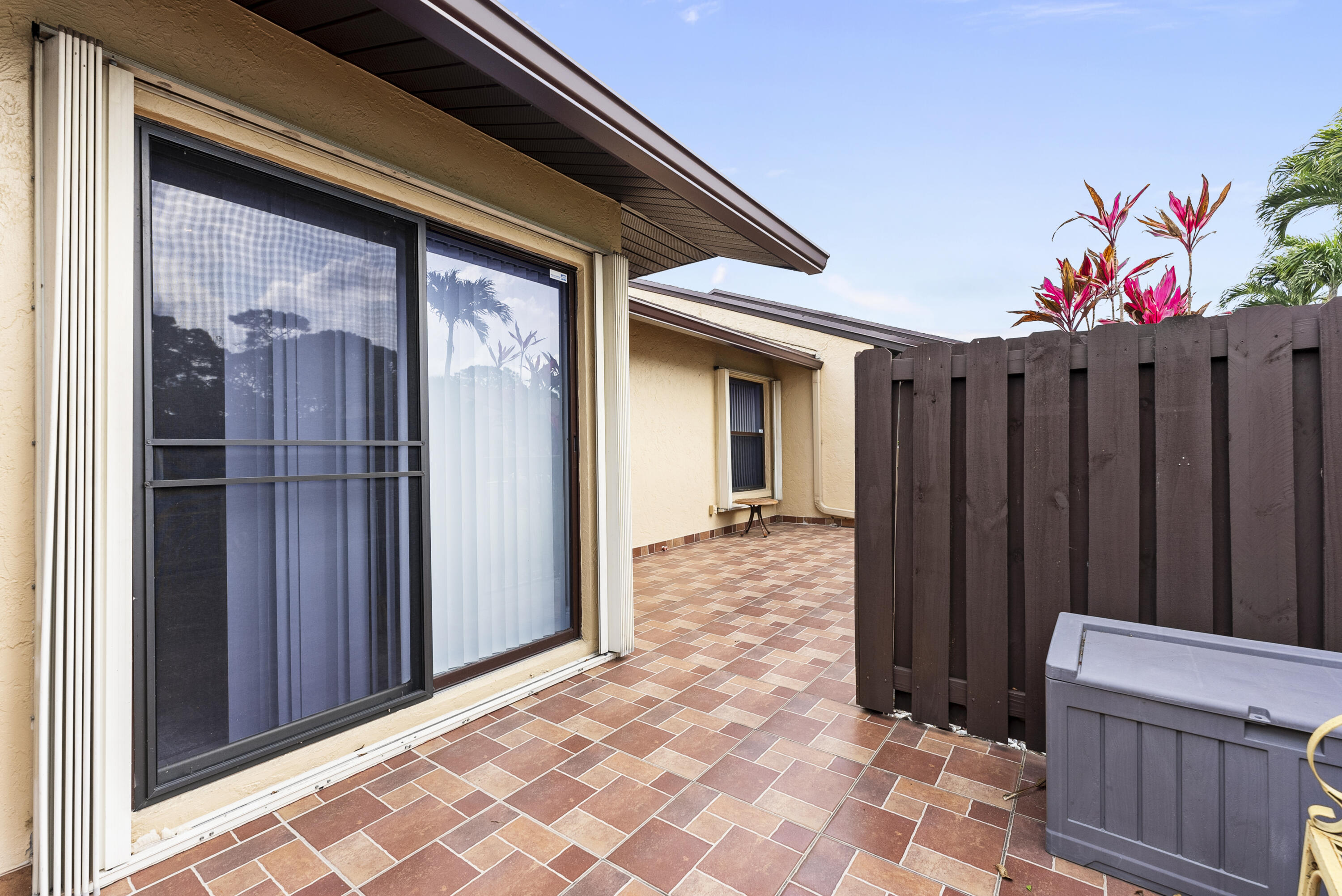 823 Sky Pine Way, Unit D Greenacres, FL 33415 - Photo 30 of 34 a backyard of a house