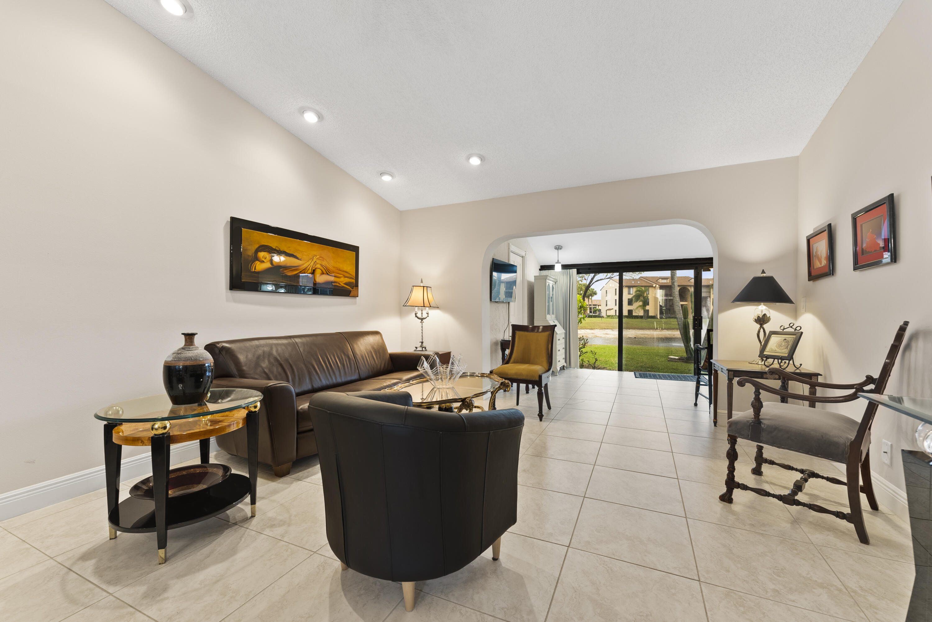 823 Sky Pine Way, Unit D Greenacres, FL 33415 - Photo 5 of 34 a living room with furniture and a flat screen tv