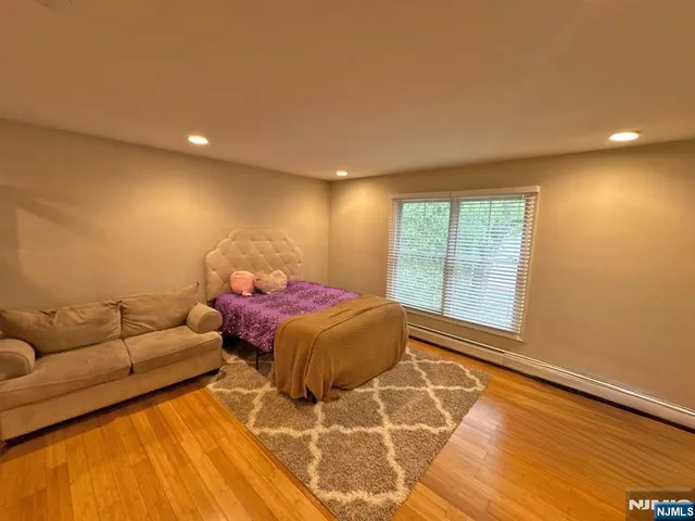 a spacious bedroom with a bed and a couch