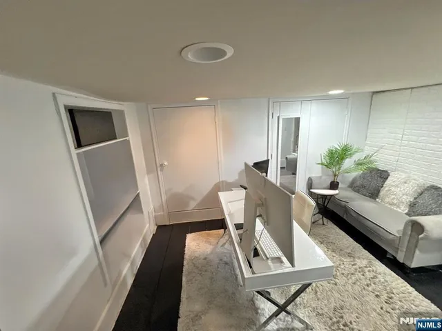 a living room with furniture and a rug