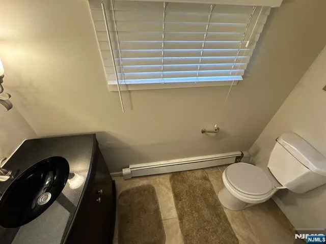 a bathroom with a toilet and a sink