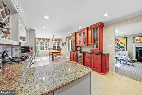 a kitchen with stainless steel appliances granite countertop sink stove and granite counter top