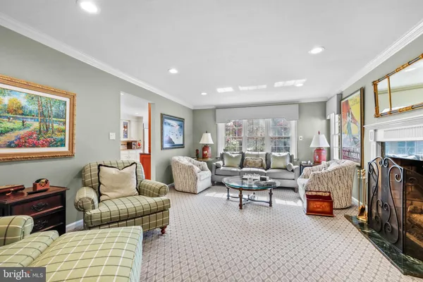 a living room with furniture flat screen tv and a fireplace