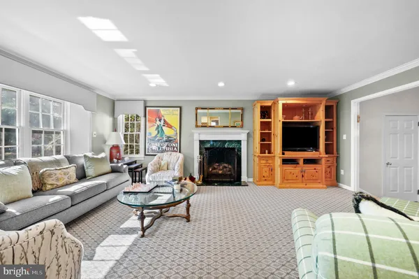 a bedroom with furniture and a fireplace